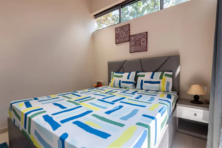 Villa bedroom with blue and white bedding