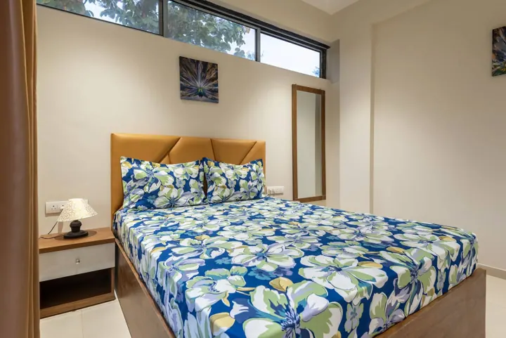 Wooden bed bedroom with wardrobe and mirror