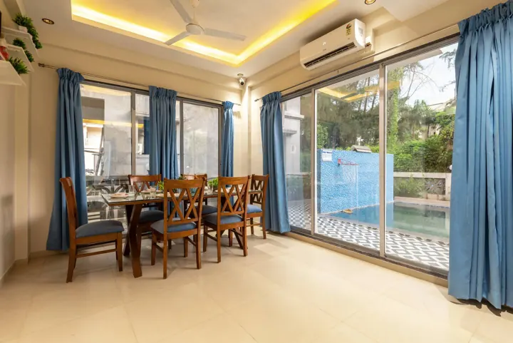 Dining area opening to the private pool
