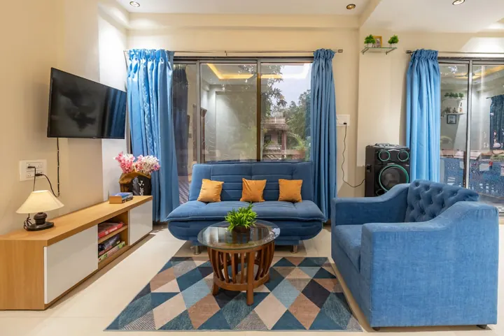 Tranquil villa living room with blue sofas