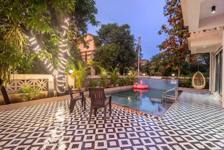 Private pool and garden of the villa in the evening